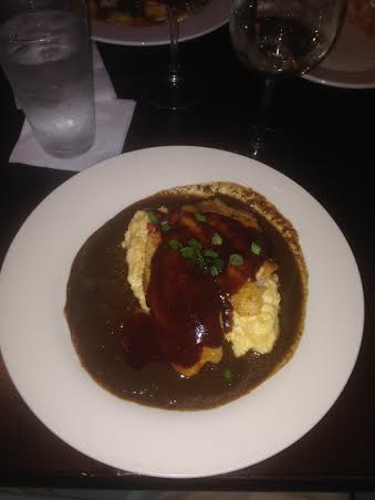 Southern BBQ Texas Redfish Honey Glazed and Fire Grilled, served over Stone-Ground Golden Grits with a Dark Roux Seafood Gravy