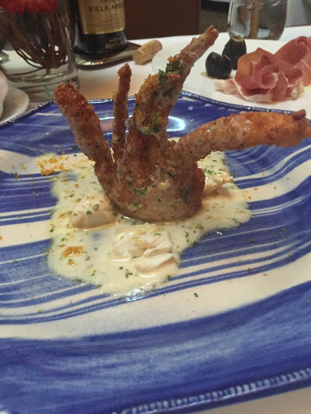 fried soft-shell crab with lump crab meat in a white wine beurre blanc sauce. 